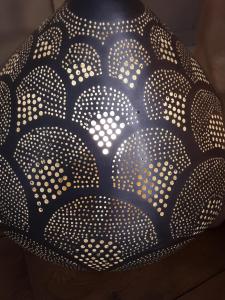 a black and white bowl with white dots on it at Villa Zawaia B&B in Lagos
