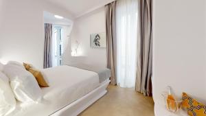 Vuode tai vuoteita majoituspaikassa Hotel Suite Generis
