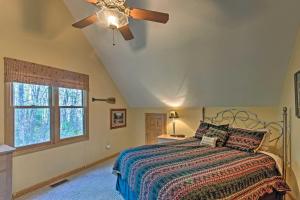 A bed or beds in a room at Spacious Maggie Valley Cabin with Hot Tub and MTN View