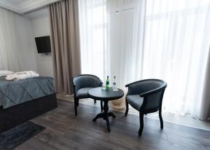 Postel nebo postele na pokoji v ubytování Downtown Suites Yerevan