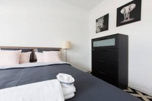 Tempat tidur dalam kamar di Cocoon - Duplex 3 chambres 140 m2