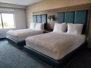 a hotel room with two beds and a window at salish Inn in Anacortes