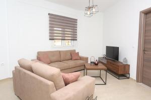 Televízia a/alebo spoločenská miestnosť v ubytovaní Mare Monte Luxury Apartments 2