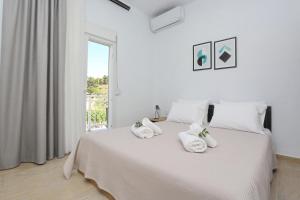 Posteľ alebo postele v izbe v ubytovaní Mare Monte Luxury Apartments 2