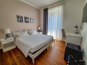 Posteľ alebo postele v izbe v ubytovaní More Cola di Rienzo B&B