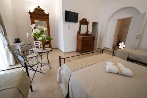 Postel nebo postele na pokoji v ubytování B&B Palazzo Loreto