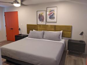 a bedroom with a bed and a dresser at 4411 Inn & Suites in Michigan City