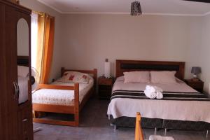 Voodi või voodid majutusasutuse Vicuña Lodge toas