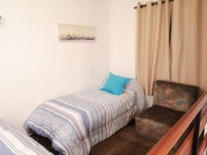 Кровать или кровати в номере Stilo Duplex En Punta Carretas