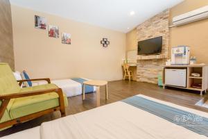 TV a/nebo společenská místnost v ubytování Hai Yuan Bungalow II