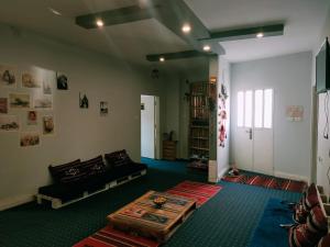 a living room with a couch and a table at Petra Main Gate in Wadi Musa
