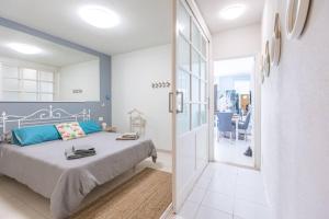 Posteľ alebo postele v izbe v ubytovaní Apartamento Corazón Playa