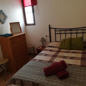 Llit o llits en una habitació de Pisito Satunde