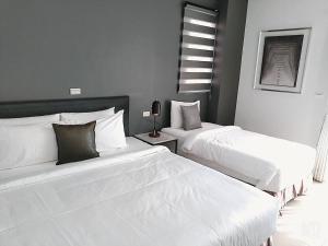 Postel nebo postele na pokoji v ubytování 禾旅宿Ho Hostel 墾丁夢幻島