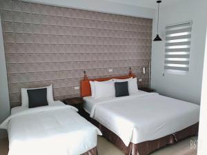 Postel nebo postele na pokoji v ubytování 禾旅宿Ho Hostel 墾丁夢幻島