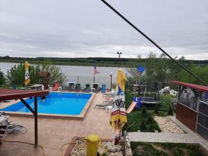 a view of a swimming pool on a house at Casa Antonia si Maria in Ostrov