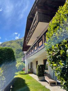 a house with a bench in front of it at Appartements Residence Ganthaler in Rablà