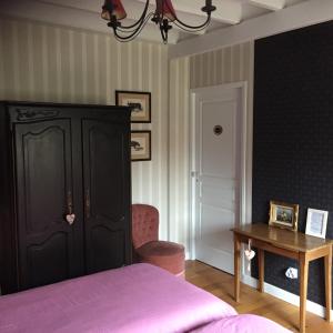 Postel nebo postele na pokoji v ubytování Chambres d'hôtes L'Aubaine avec jacuzzi