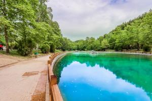 a pool of blue water next to a fence at Suite Acropolis Serres Next To Center in Serres