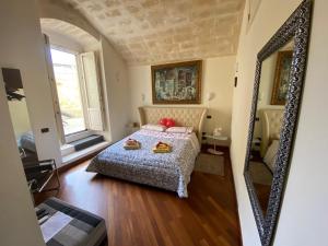 Postel nebo postele na pokoji v ubytování Alla dimora di Chiara Suite and Rooms