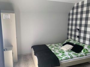 Łóżko lub łóżka w pokoju w obiekcie U Halinki