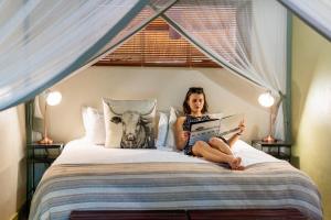 Voodi või voodid majutusasutuse Nguni Lodge toas