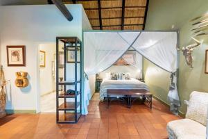 Voodi või voodid majutusasutuse Nguni Lodge toas