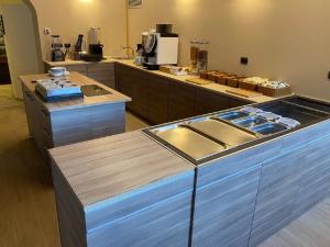Kuchyň nebo kuchyňský kout v ubytování Hotel Trieste