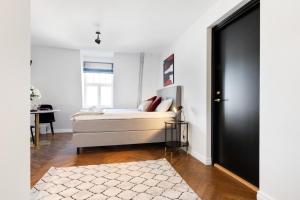 a living room with a bed and a table at Bob W Avangard in Tallinn
