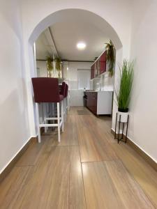 a living room with a table and a kitchen at Casa Maria in Alba Iulia