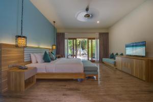 Postel nebo postele na pokoji v ubytování Rahaa Resort Maldives