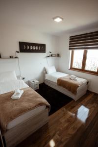 Кровать или кровати в номере Zlatar Apartman br 16