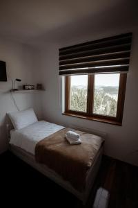 Uma cama ou camas num quarto em Zlatar Apartman br 16
