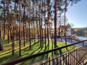 a view of a house from a balcony with trees at Заміський комплекс "Пуща Лісна" in Moshchun