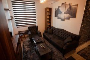 Uma área de estar em Zlatar Apartman br 16