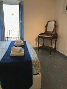 Rúm í herbergi á Hannette Cinqueterre Apt Libeccio