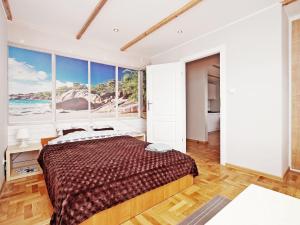 Posteľ alebo postele v izbe v ubytovaní Apartamenty Gdynia
