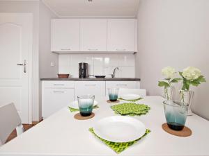 Kuchyňa alebo kuchynka v ubytovaní Apartamenty Gdynia