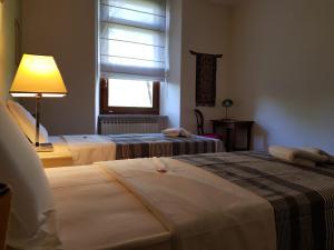 Ліжко або ліжка в номері Appartamento Binario 1