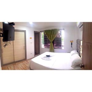 Postel nebo postele na pokoji v ubytování Hotel ibiza Central + 2 fotografie