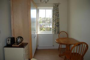 a small room with a table and a window at Over Studio Apartment in Over
