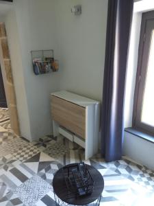 a remote control sitting on a floor in a room at Pigeonnier in Vic-le-Comte