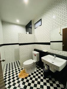 a bathroom with a toilet and a sink at Dark Sugar Resort in Ban Bo Thong +37 photos