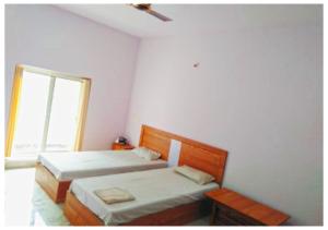 AYM Yoga Resort Arambol GOA客房内的一张或多张床位