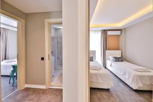 A bed or beds in a room at Duygu Apart