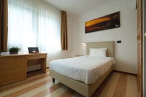 Posteľ alebo postele v izbe v ubytovaní Hotel Portavaldera