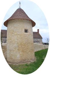 a round picture of a building with a roof at La Fauconnière in Brécy