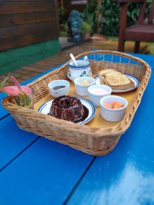 a basket filled with food on top of a table at Long Life Campeche-Pousada in Florianópolis