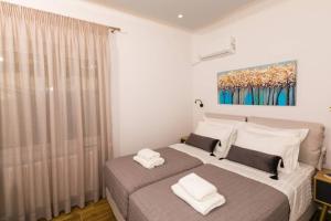 A bed or beds in a room at Chrysi's Ocean View Retreat