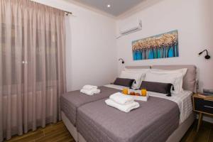 A bed or beds in a room at Chrysi's Ocean View Retreat